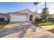 Charming single-Gathering home with a two-car garage and well-maintained landscaping at 319 Bailey Cir, Davenport, FL 33897