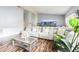 Inviting living room features a plush sofa, wood flooring, and a decorative aquarium at 319 Bailey Cir, Davenport, FL 33897