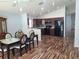 Inviting space with dining area, open layout, and modern kitchen with black appliances at 319 Bailey Cir, Davenport, FL 33897