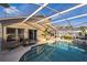 Enclosed pool area with a sparkling pool, inviting seating, and well-kept surroundings at 319 Bailey Cir, Davenport, FL 33897