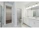 Modern bathroom with double sink vanity, shower, and toilet, providing functionality and style at 5932 Bristle Oak St, Mount Dora, FL 32757