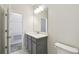 Bathroom with gray vanity and modern lighting at 5932 Bristle Oak St, Mount Dora, FL 32757