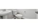 Bathroom featuring a pedestal sink, a toilet, and silver hardware at 5932 Bristle Oak St, Mount Dora, FL 32757