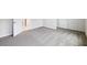 Spacious carpeted room featuring two doorways and neutral walls at 5932 Bristle Oak St, Mount Dora, FL 32757