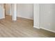 Hallway features modern flooring, white trim, and neutral paint at 5932 Bristle Oak St, Mount Dora, FL 32757