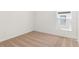 Light filled bedroom featuring carpeted floors, a window and white walls at 1633 Nantucket Way, Winter Haven, FL 33884