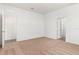 Spacious carpeted bedroom with two open doorways to the hall and ensuite bathroom with walk-in closet at 1633 Nantucket Way, Winter Haven, FL 33884