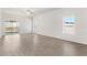Spacious living room featuring sleek flooring, ample natural light, and an open layout perfect for entertaining at 1633 Nantucket Way, Winter Haven, FL 33884