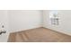 Bright bedroom with neutral carpet, a window, and a doorway at 1782 White Elephant Loop, Winter Haven, FL 33884