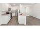 Elegant kitchen highlighting granite counters, stainless steel appliances, crisp white cabinets, and a handy kitchen island at 1782 White Elephant Loop, Winter Haven, FL 33884