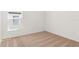 Bedroom features neutral carpet, a window, and white walls at 1791 White Elephant Loop, Winter Haven, FL 33884
