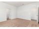 Neutral carpeted bedroom with white walls and two doors for easy access at 1802 White Elephant Loop, Winter Haven, FL 33884