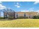 Expansive backyard with large screened lanai and plenty of green space at 1892 Sanderling Dr, Clermont, FL 34711