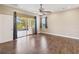 Bedroom with ceiling fan and outdoor patio access through sliding glass doors at 1892 Sanderling Dr, Clermont, FL 34711