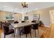 Open-concept dining area with stylish lighting, seating for six, and views of the living area at 1892 Sanderling Dr, Clermont, FL 34711