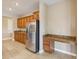 Kitchen view featuring stainless steel refrigerator, granite countertops, and desk at 1892 Sanderling Dr, Clermont, FL 34711