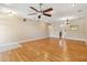 Large living space with hardwood floors, ceiling fan, and recessed lighting at 1892 Sanderling Dr, Clermont, FL 34711