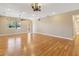 Hardwood floor living room with ceiling fan and recessed lights at 1892 Sanderling Dr, Clermont, FL 34711