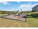 Community playground with modern equipment and scenic views of lake at 1892 Sanderling Dr, Clermont, FL 34711