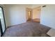 Well-lit living area with neutral carpet, large windows and easy access to other rooms in the home at 3700 Idlebrook Cir # 206, Casselberry, FL 32707