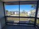 Relaxing view from the screened-in porch, showcasing the community's lush landscape, promising serenity at 3700 Idlebrook Cir # 206, Casselberry, FL 32707