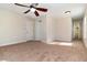 Spacious bedroom featuring a ceiling fan and neutral carpeting throughout at 3930 Cassia Dr, Orlando, FL 32828