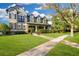 Beautiful home featuring a well-manicured lawn, lush landscaping, and a welcoming walkway at 3930 Cassia Dr, Orlando, FL 32828