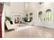Elegant foyer features large windows, tiled floors, and double entry doors with decorative glass at 3930 Cassia Dr, Orlando, FL 32828