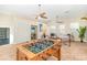 Spacious game room featuring foosball table, ceiling fans, and comfortable seating at 3930 Cassia Dr, Orlando, FL 32828