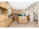 Spacious kitchen features stainless steel appliances, wooden cabinets, and a kitchen island at 3930 Cassia Dr, Orlando, FL 32828