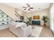 Inviting living room with a decorative cabinet, ceiling fan, and a view of the staircase at 3930 Cassia Dr, Orlando, FL 32828