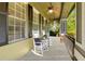 Inviting porch showcases rocking chairs with decorative pillows creating a relaxing outdoor space at 3930 Cassia Dr, Orlando, FL 32828