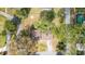 Aerial view of a home with a brown roof surrounded by lush greenery at 1326 Se 34Th Ter, Ocala, FL 34471