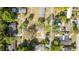 Aerial view of a home nestled in a quiet neighborhood with mature trees at 1326 Se 34Th Ter, Ocala, FL 34471