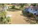 Large backyard featuring a chain-link fence, mature trees and a patio at 1326 Se 34Th Ter, Ocala, FL 34471