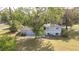 Aerial view of backyard featuring trees and a patio at 1326 Se 34Th Ter, Ocala, FL 34471