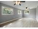 Large, bright room features light gray walls, light wood flooring and large windows at 1326 Se 34Th Ter, Ocala, FL 34471
