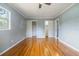 Bright bedroom with hardwood floors, ceiling fan, and natural light from the window at 1326 Se 34Th Ter, Ocala, FL 34471