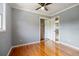 Hardwood-floored bedroom featuring a window and closet space, providing ample storage at 1326 Se 34Th Ter, Ocala, FL 34471