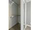 Small closet featuring shelving, a sliding mirrored door, light gray walls and laminate wood floor at 1326 Se 34Th Ter, Ocala, FL 34471