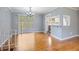 Bright dining area with hardwood floors, slider to outside, and access to updated kitchen at 1326 Se 34Th Ter, Ocala, FL 34471
