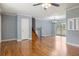 Spacious living room with gleaming hardwood floors, a staircase, and plenty of natural light at 1326 Se 34Th Ter, Ocala, FL 34471
