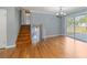 Open concept living room features hardwood floors, staircase, and sliding glass doors to patio at 1326 Se 34Th Ter, Ocala, FL 34471