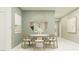 Elegant dining room featuring a round table with modern chairs, complemented by a neutral color scheme and stylish decor at 4743 Bold Peacock Bnd, Bartow, FL 33830