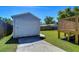 View of the detached garage from the backyard and deck area at 829 E Lime St, Lakeland, FL 33801