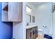 Stylish bathroom with modern vanity, sleek mirror, and cabinet for extra storage at 829 E Lime St, Lakeland, FL 33801