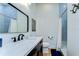 Stylish bathroom with modern vanity, sleek mirror, and tiled shower with shower curtain at 829 E Lime St, Lakeland, FL 33801