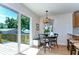 Breakfast nook area with bright light and sliding glass door to deck at 829 E Lime St, Lakeland, FL 33801