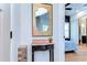 Entryway features a decorative mirror, table, and decor. Bedroom visible in the background at 829 E Lime St, Lakeland, FL 33801