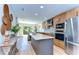 Bright, open kitchen with modern appliances, granite countertops, and connection to the living area at 829 E Lime St, Lakeland, FL 33801